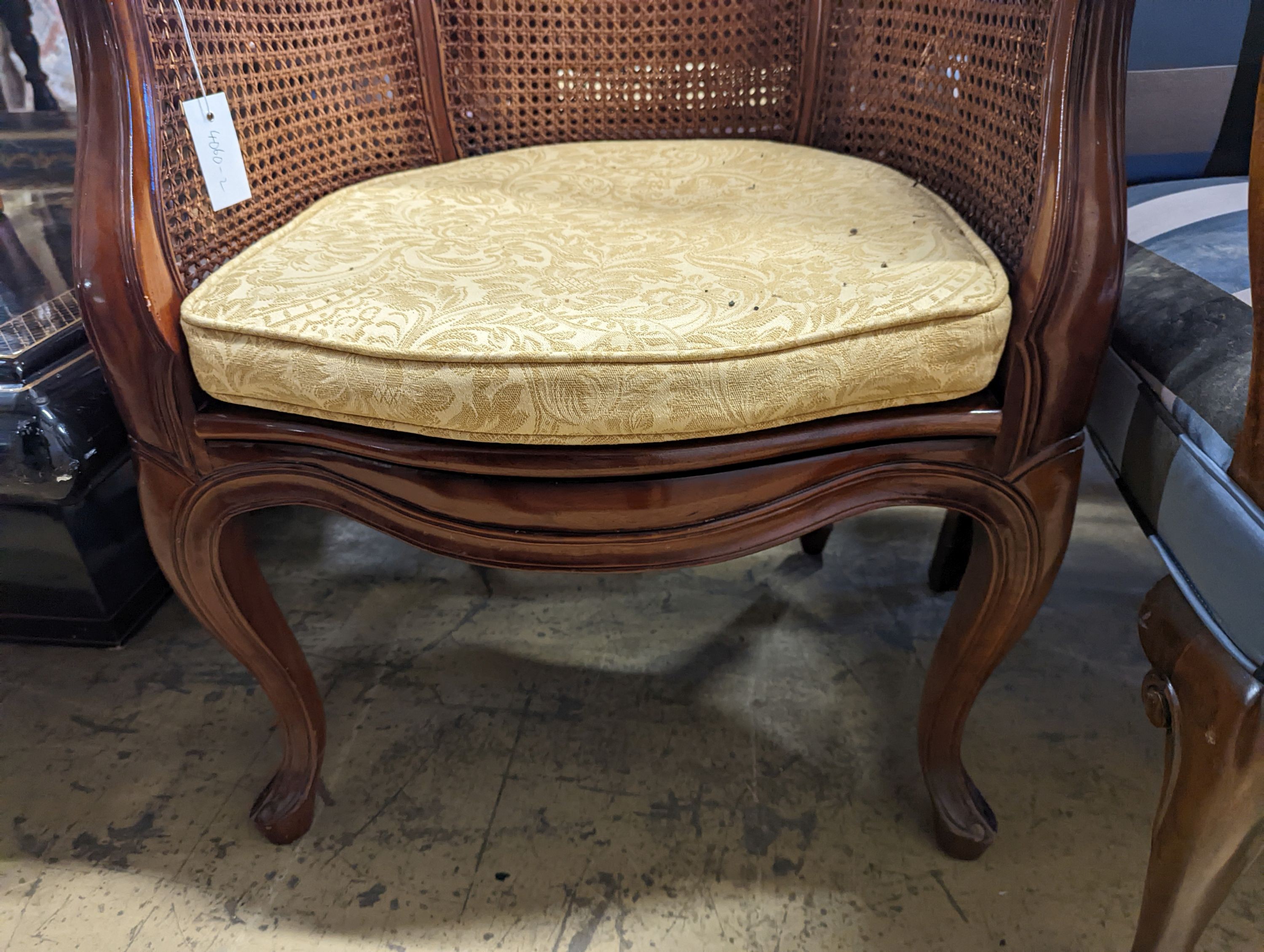 A pair of French mahogany bergere tub chairs, width 62cm, depth 50cm, height 86cm